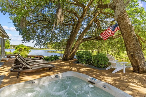Gorgeous waterfront home with private hot tub, pool, views, deck, & fireplace