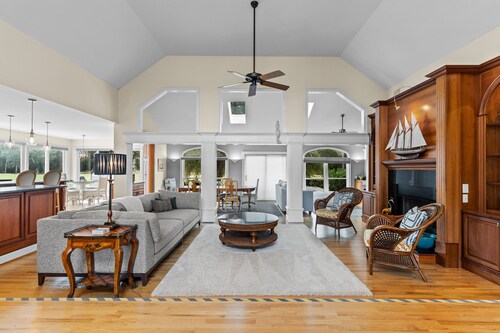 Gorgeous waterfront home with private hot tub, pool, views, deck, & fireplace