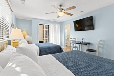 Beachside resort condo with screened balconies & golf