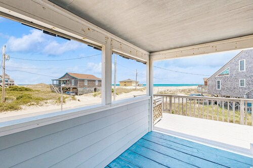 Ocean-view home steps from the beach with deck, outdoor shower, & central AC