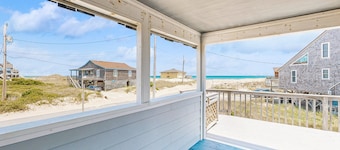 Ocean-view home steps from the beach with deck, outdoor shower, & central AC