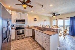 Fridge, microwave, oven, stovetop - Oceanfront condo with wraparound balcony, fast WiFi, and on-site pool/hot tub (Hatteras)