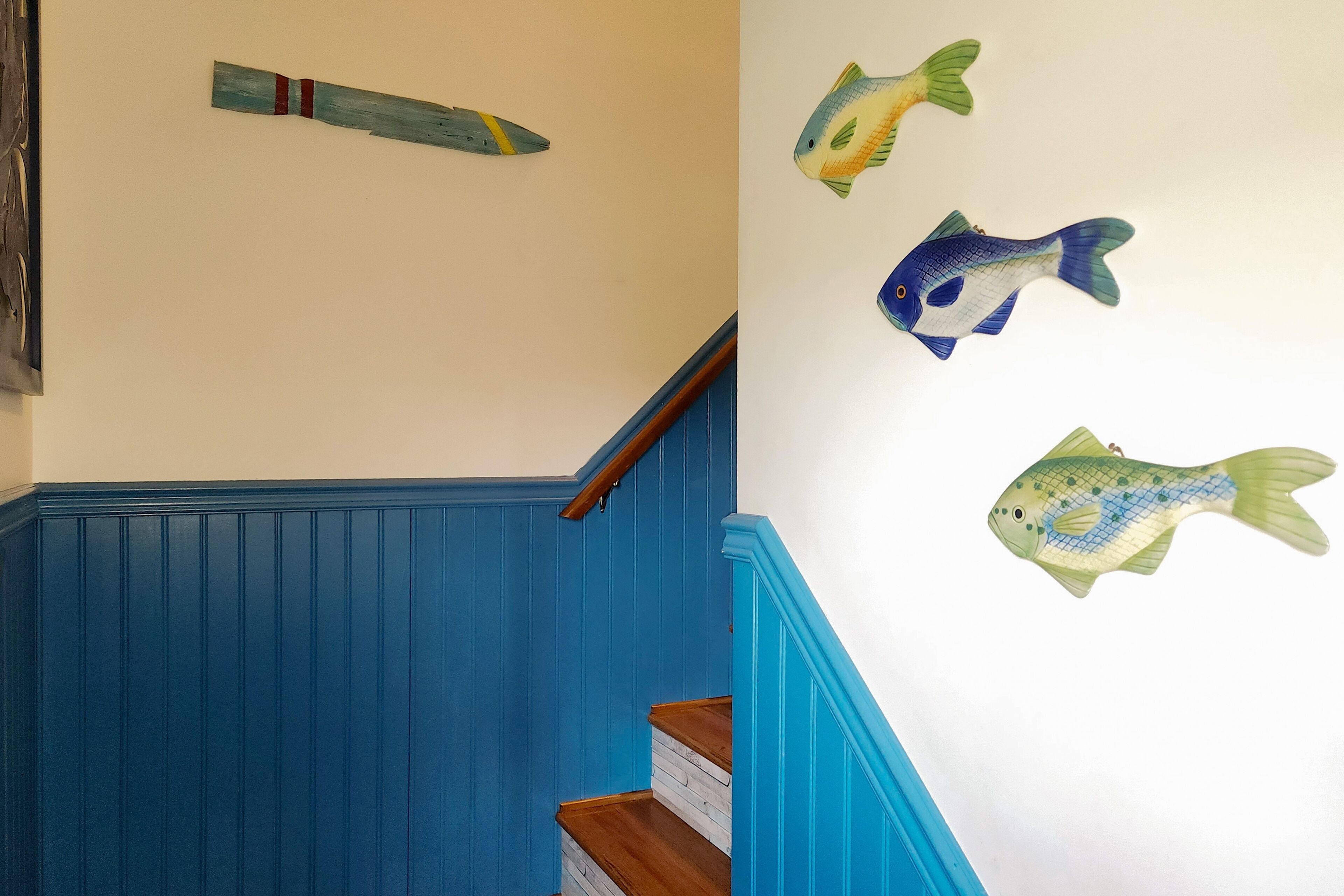 A staircase with blue walls and wooden steps.