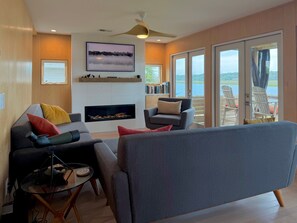 TV, fireplace - Custom home on the Intracoastal with water views, pool, dock, & decks (Holden Beach)