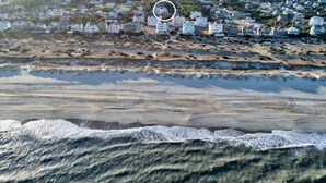 A coastal town with beachfront properties and a sandy beach. - Beautiful house with private pool, hot tub, central AC, & washer/dryer (Salvo)