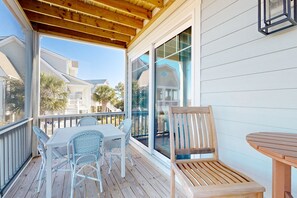 Outdoor dining - Beach Hunters- Spacious newly built coastal home with scenic views, private pool & Tiki Bar (Holden Beach)
