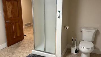 Shower, towels, soap, toilet paper