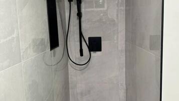 Shower, towels, soap, toilet paper