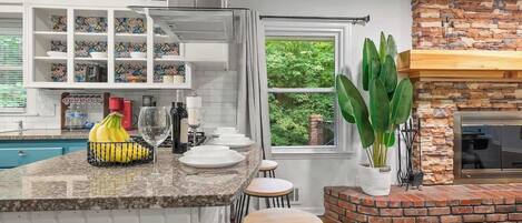 Fridge, stovetop, dishwasher, coffee/tea maker