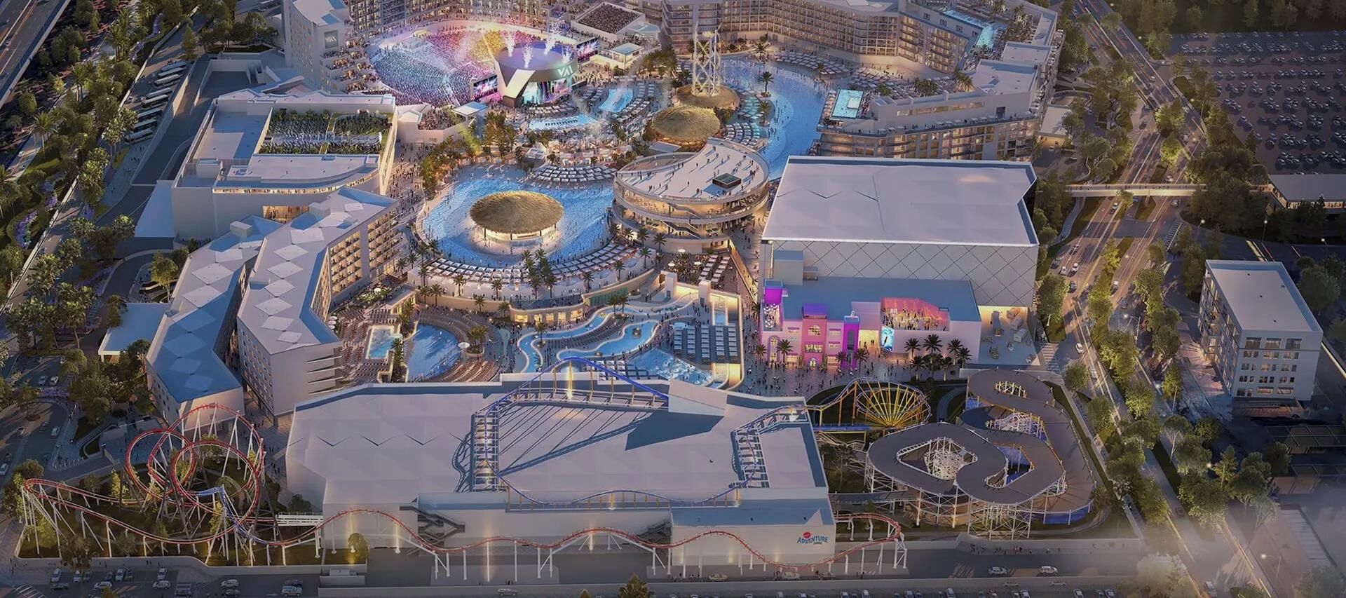 A large resort with multiple swimming pools, a central amphitheater, and a roller coaster.