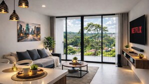 A modern living room with a sofa, coffee table, and a TV mounted on the wall. - LUJOSO APTO NORTE DE ARMENIA (Armenia)
