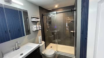 Shower, eco-friendly toiletries, hair dryer, towels