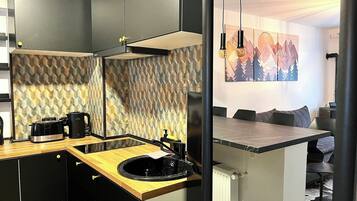 Fridge, microwave, stovetop, coffee/tea maker