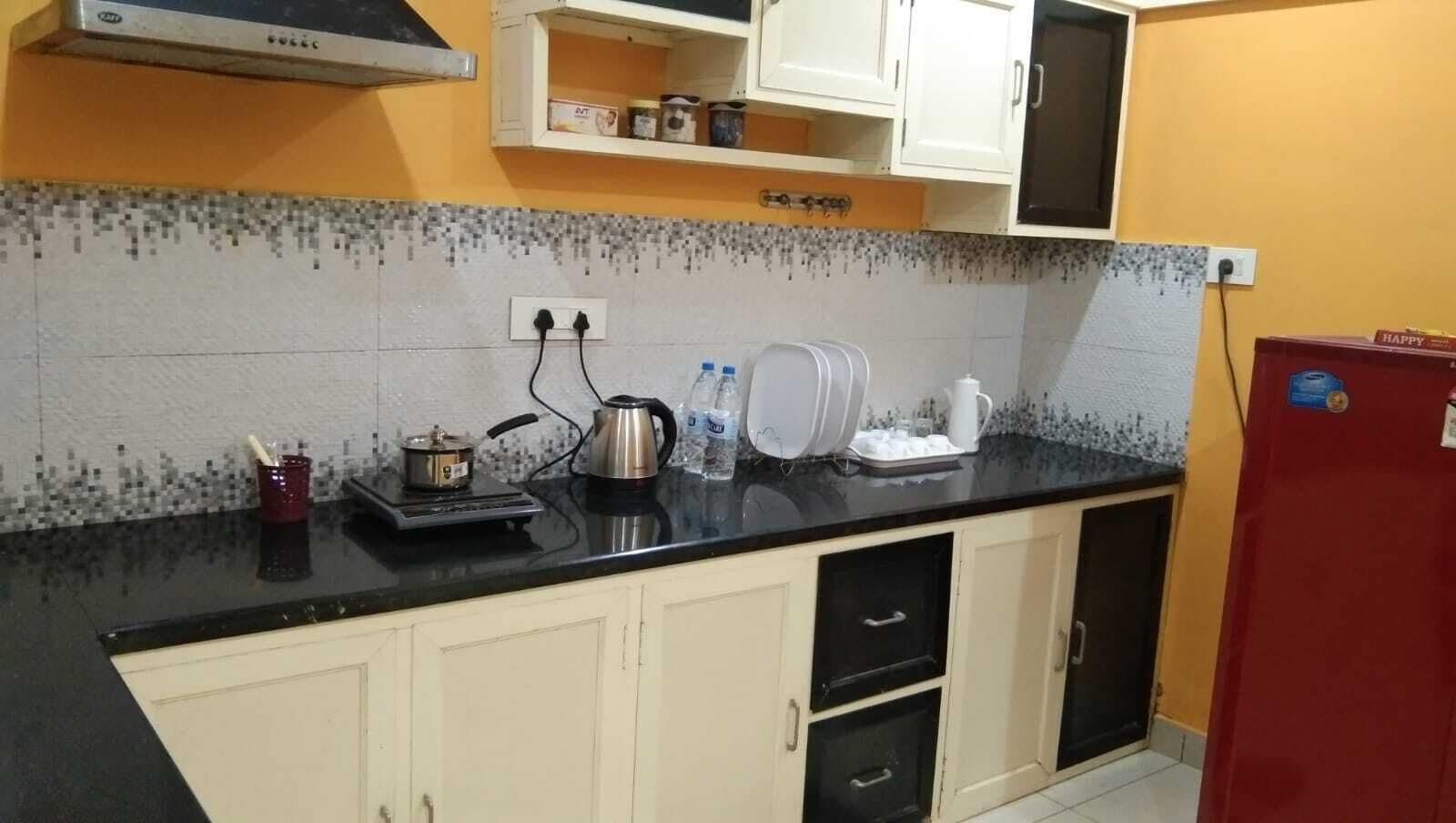 Fridge, stovetop, electric kettle, cookware/dishes/utensils