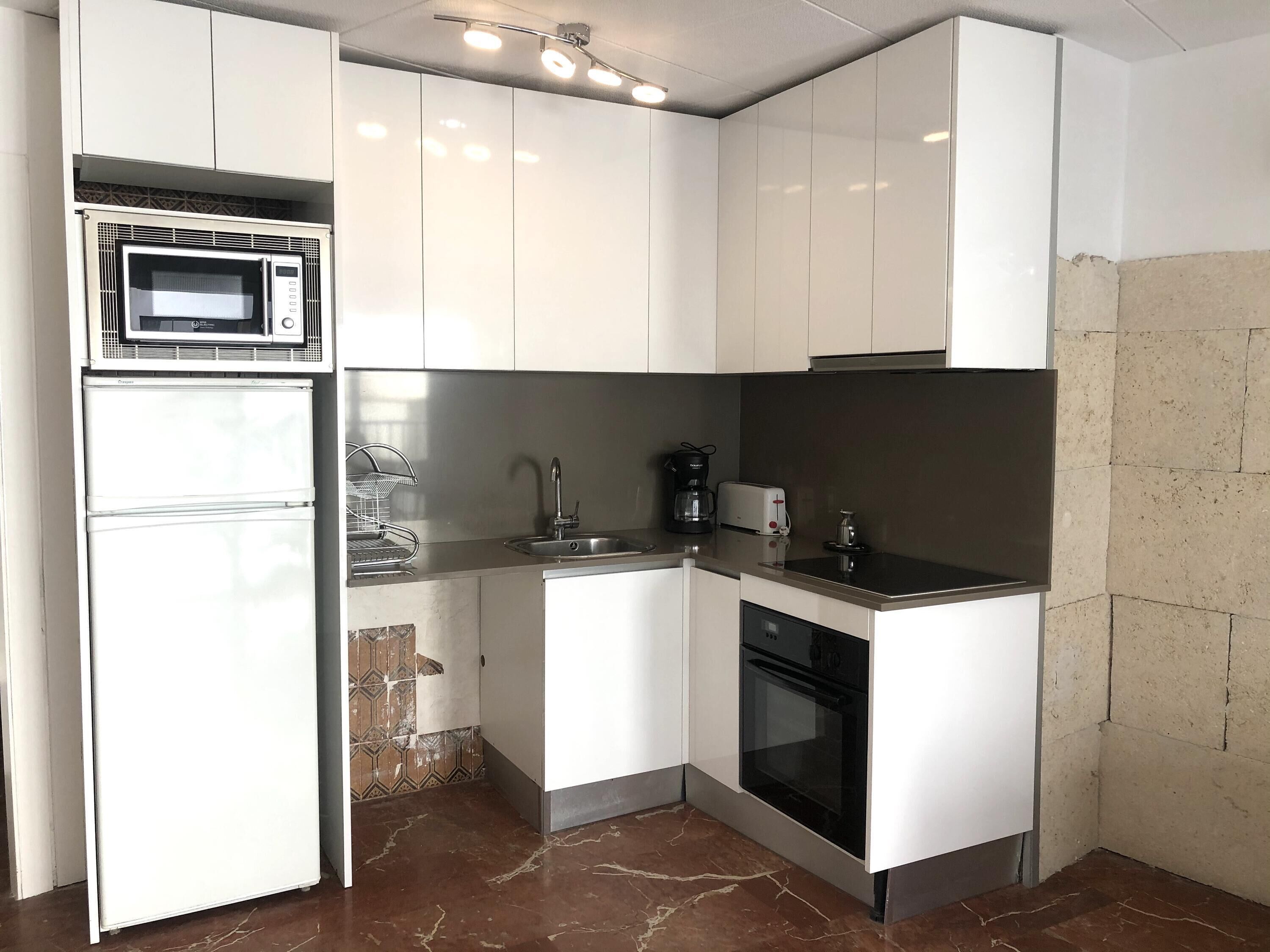 Microwave, oven, coffee/tea maker, cookware/dishes/utensils