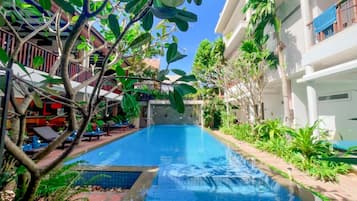 Outdoor pool, open 9:00 AM to 9:00 PM, free cabanas, pool umbrellas