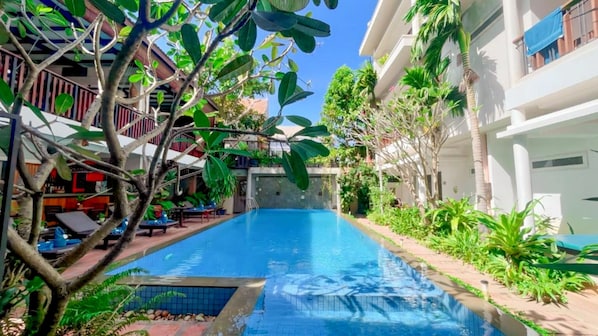 Outdoor pool, open 9:00 AM to 9:00 PM, free cabanas, pool umbrellas