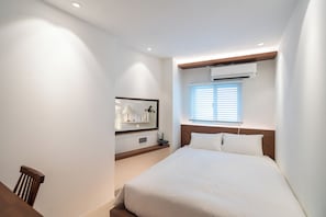 Chambre Double Deluxe | Literie de qualité supérieure, couette en duvet d'oie