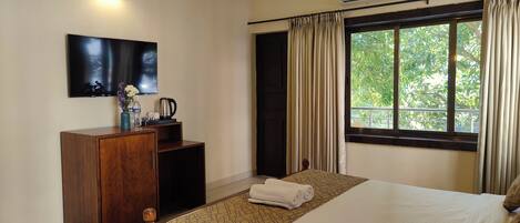 Desk, laptop workspace, blackout curtains, iron/ironing board