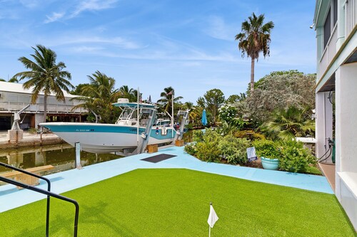 Coastal canalfront home with swim spa, dock, kayaks, e-bikes & dog friendly