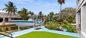 Coastal canalfront home with swim spa, dock, kayaks, e-bikes & dog friendly