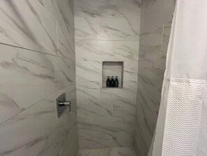 Shower, towels, soap, toilet paper