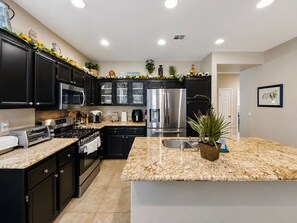 Coffee/tea maker, fridge, microwave, oven
