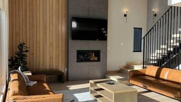 Smart TV, fireplace, foosball, books