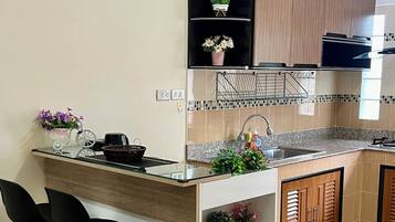 Fridge, microwave, toaster, cookware/dishes/utensils