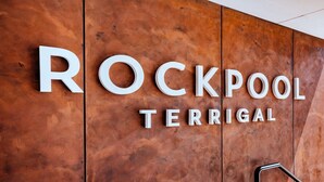 A wooden wall with the words "ROCKPOOL TERRIGAL" in white letters. - ROCKPOOL #101 | Walk to beach, WIFI | Accom Holidays (TERRIGAL)