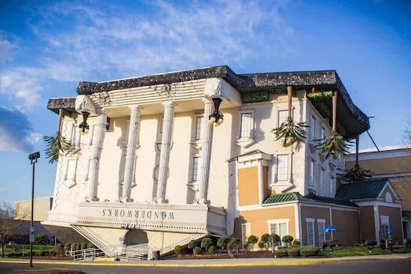 A hotel with classical architecture, featuring columns and a grand entrance.