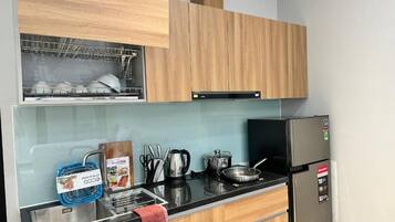 Standard Double Room | Private kitchen | Full-size fridge, microwave, cookware/dishes/utensils