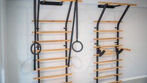 Two wall-mounted exercise bars with wooden horizontal bars and black vertical supports. - Apartment 'Riversidesuite Tübingen' with Shared Terrace, Shared Garden and Wi-Fi (Tübingen)