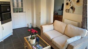 House, 3 Bedrooms, Garden View | Living room | Flat-screen TV, books - Comfortable 5 - Guest Abode - In Quiet Village (Grantham)