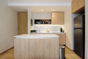 Fridge, microwave, stovetop, coffee/tea maker