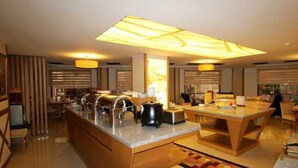 A modern kitchen with a central island, built-in appliances, and a large window. - Levent Hotel Istanbul (Istanbul)