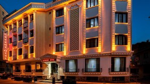 A multi-story hotel with a classic architectural style, featuring balconies and a prominent entrance. - Levent Hotel Istanbul (Istanbul)