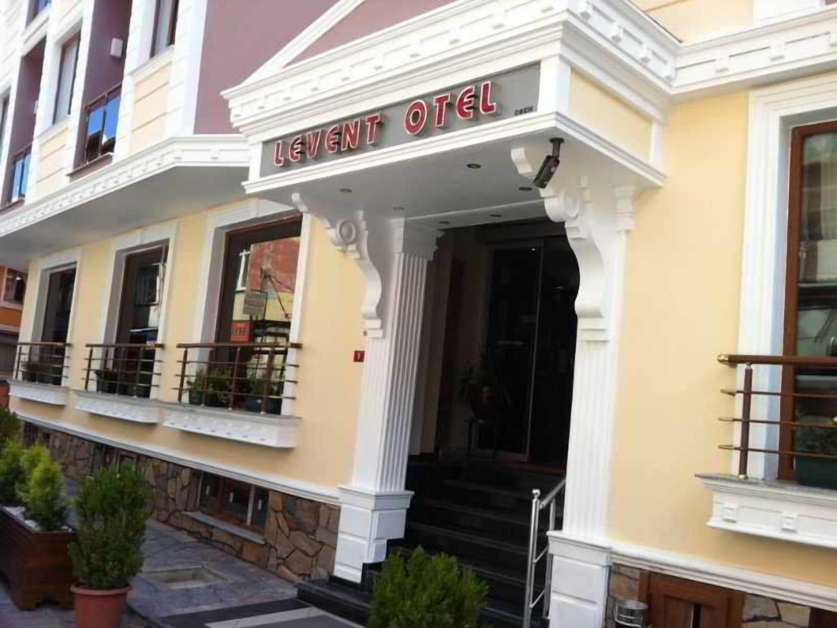 A hotel entrance with a sign reading 'LEVENT HOTEL.'