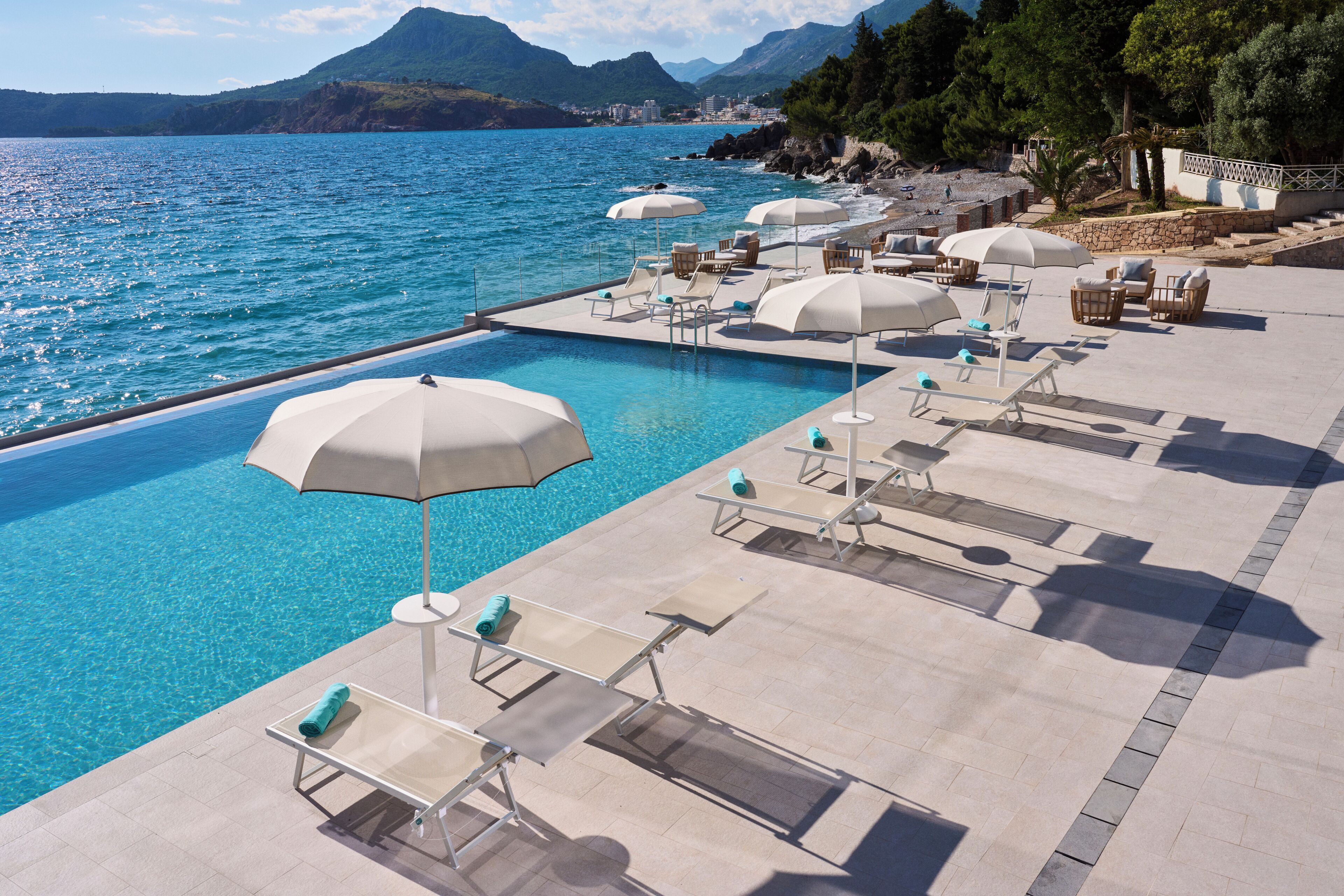 Indoor pool, seasonal outdoor pool, pool umbrellas, pool loungers