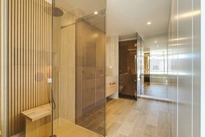 Shower, hair dryer, towels, shampoo