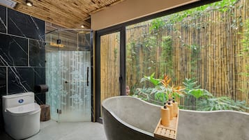 Deluxe Bungalow with Garden View | Bathroom | Separate bathtub and shower, rainfall showerhead, designer toiletries