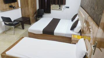 Family Triple Room, City View | In-room safe, blackout drapes, soundproofing, iron/ironing board