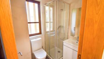 Shower, towels, soap, toilet paper