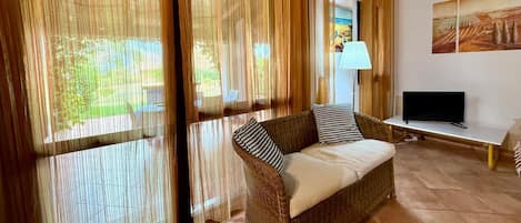 Apartment | Living area | 22-inch flat-screen TV with cable channels