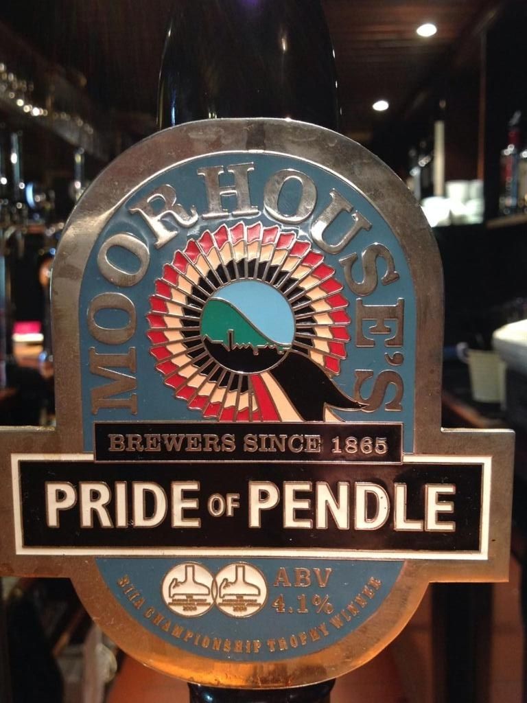 A beer tap with a label that reads 'Moorhouse S.M.S. Brewers Since 1885' and 'Pride of Pendle' with an ABV of 4.1%.