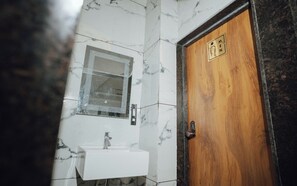 Shower, slippers, toilet paper