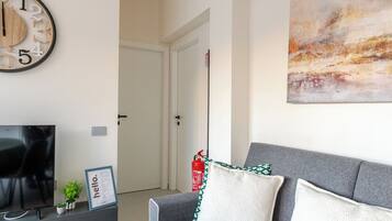 Suite, vistas a la ciudad | Zona de estar