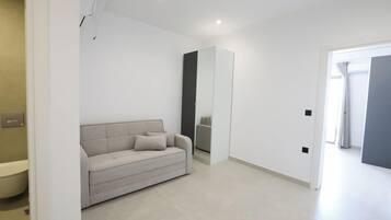 Luxury Suite, Balcony | Minibar, blackout drapes, soundproofing, iron/ironing board