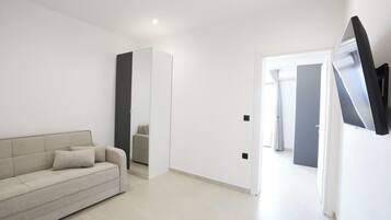 Luxury Suite, Balcony | Minibar, blackout curtains, soundproofing, iron/ironing board