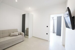 Lyxsvit - balkong | Minibar, mörkläggningsgardiner, ljudisolering och strykjärn/strykbräda